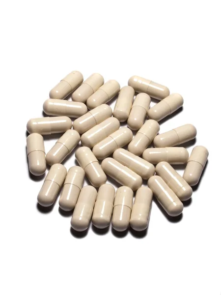 White capsules on Isolated white background — Stock Photo, Image