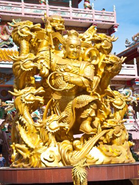 Goddess NaZha beating the dragon and china temple Chonburi Thail clipart