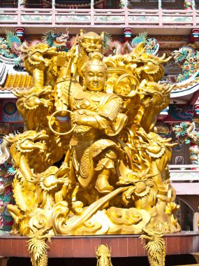 Goddess Naja beating the dragon and china temple Chonburi Thaila clipart
