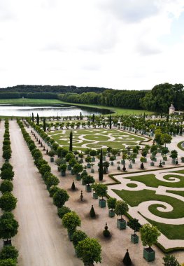 Famous palace Versailles , beautiful ornamental gardens clipart