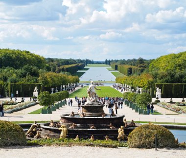 Versailles Castle gardens with fountain & tourists clipart