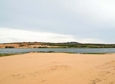 Lake at a white sand dune , Mui Ne in Vietnam clipart
