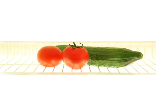 Cremalheira com legumes na geladeira — Fotografia de Stock