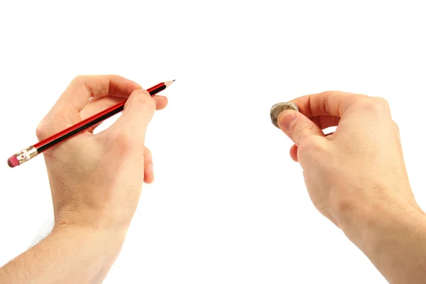 Bleistift und Radiergummi in den Händen — Stockfoto