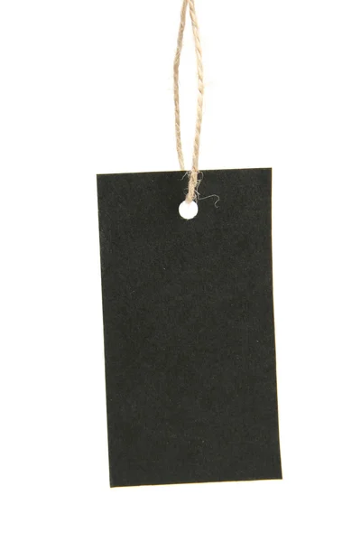 Etiqueta preta em branco pendurada em uma corda — Fotografia de Stock