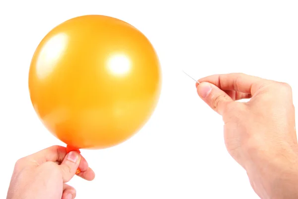 Hand met ballon en naald — Stockfoto