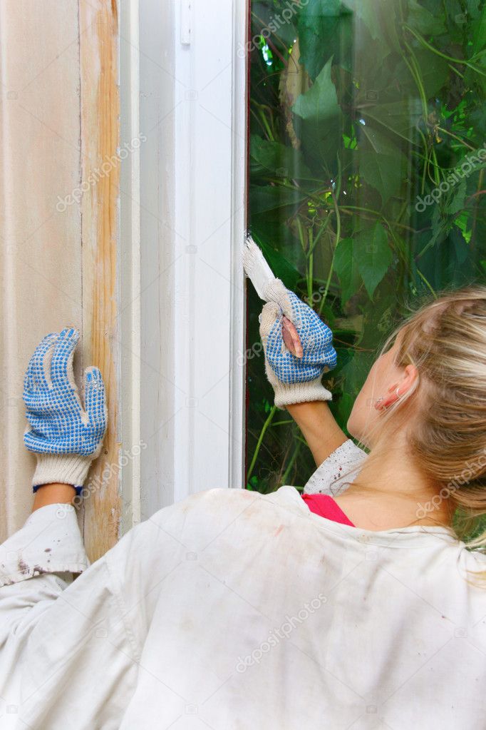 Woman restores the window frame color