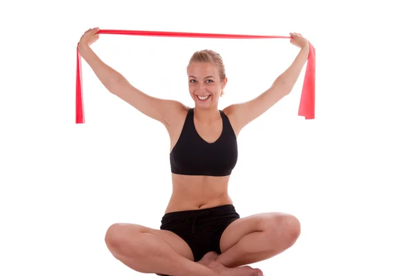 A young woman with a stretch band — Stock Photo, Image