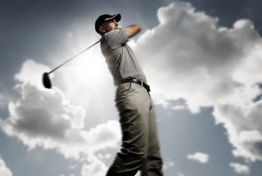 Golfer shooting a golf ball clipart