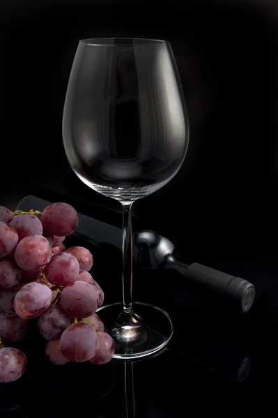 Glass, grapes and bottle of wine — Stock Photo, Image