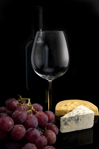 Glass of wine with grapes and cheese — Stock Photo, Image