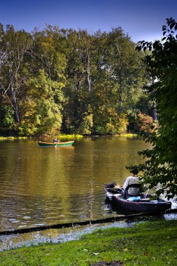 Fishing man on the lake clipart