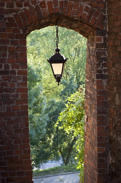 Hanging lamp in the gate of Sandomierz — Stock Photo, Image