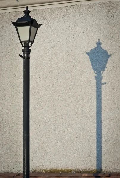 Old fashioned street light with shadow — Stock Photo, Image