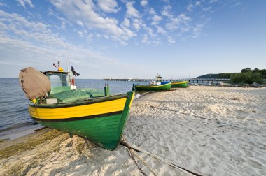 Fishing boat on the seaside clipart