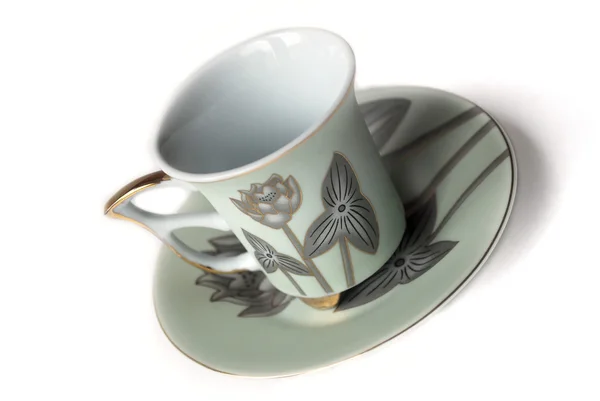 stock image Empty cup and saucer with pattern