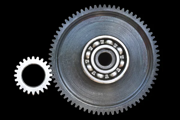 Gear wheels on black surface — Stock Photo, Image