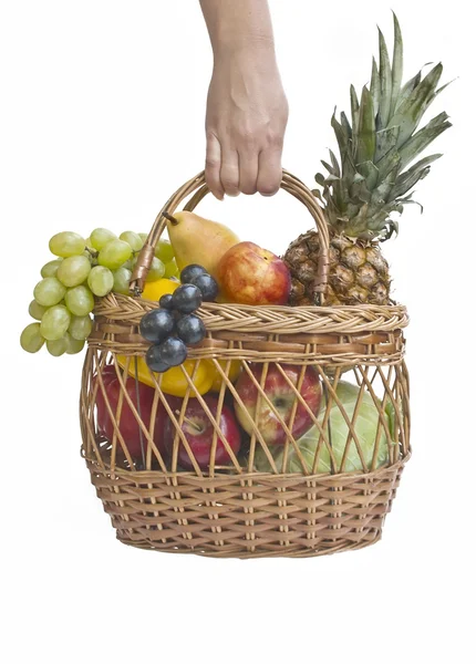 Frutas na cesta na mão — Fotografia de Stock