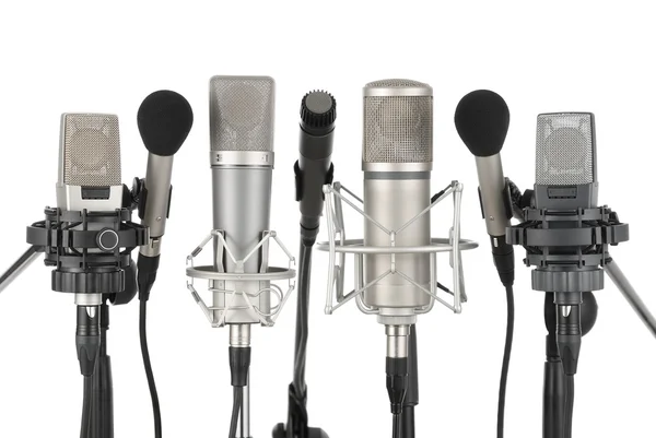 Fila de sete microfones — Fotografia de Stock