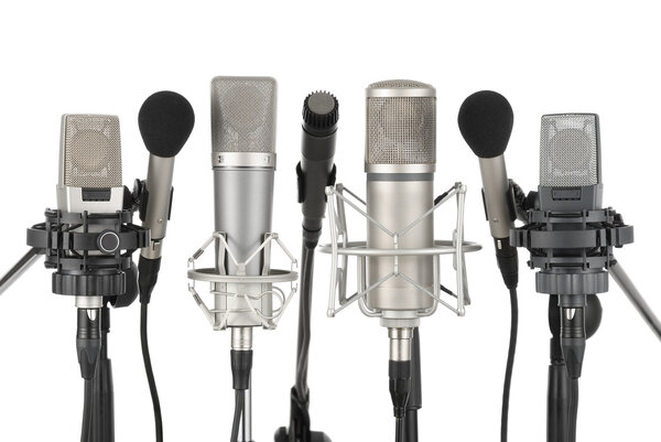 Row of seven microphones