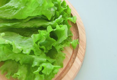 Fresh green salad on the breadboard