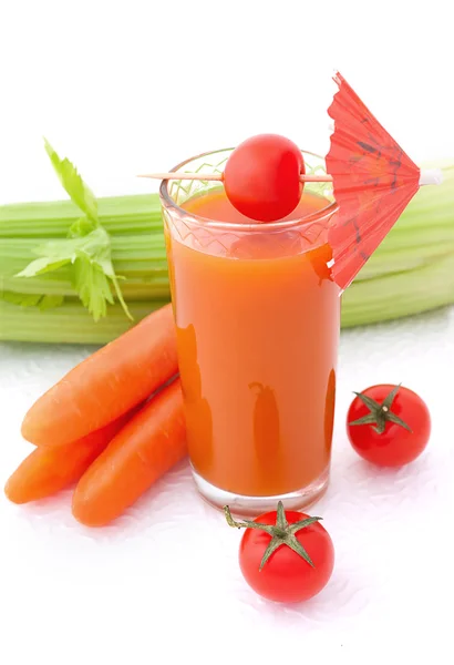 Glass of vegetable juice with umbrella — Stock Photo, Image