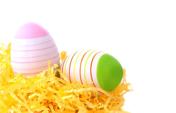Dvě velikonoční vejce v hnízdě žlutá — Stock fotografie