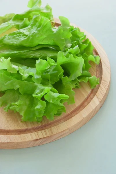 Fresh green salad on the breadboard