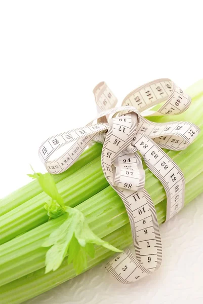 Celery with tape measure, concept of diet — Stock Photo, Image