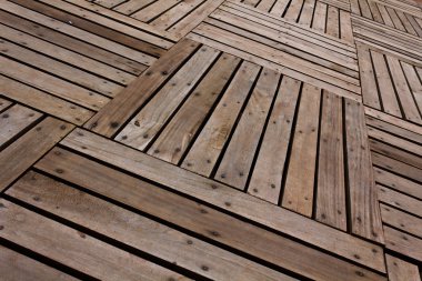 Patterns and textures of a wooden planks pavement clipart