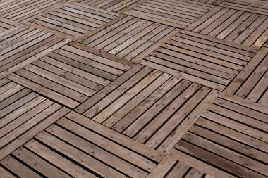 Patterns and textures of a wooden planks pavement clipart