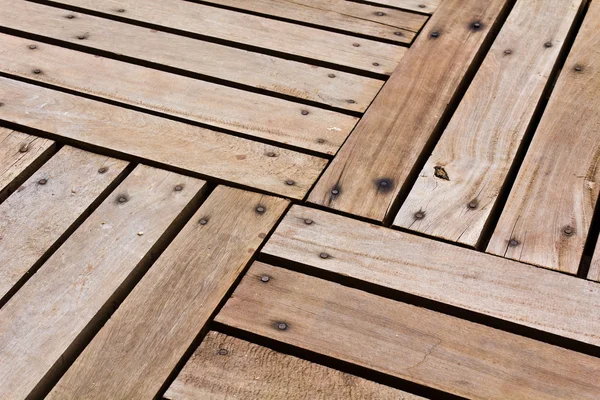 Patterns and textures of a wooden planks pavement — Stock Photo, Image