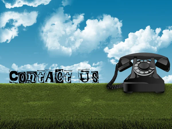 Old telephone in grass — Stock Photo, Image