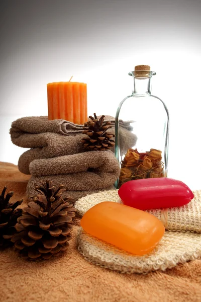Soaps, towels and pine cones — Stock Photo, Image