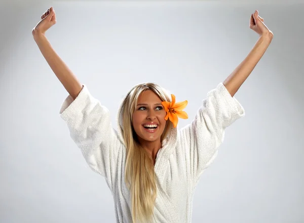 stock image Attractive girl in a white bathrobe feeling happy