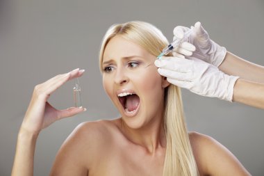 Blonde girl and botox injection 3 clipart
