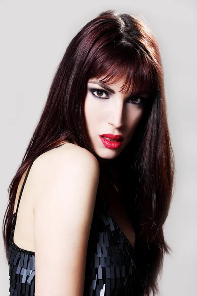 Attractive brunette model in a black retro dress, closeup — Stock Photo, Image