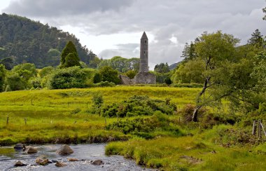 Round tower at Glendalough clipart