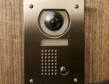 Door intercom with camera on wood clipart
