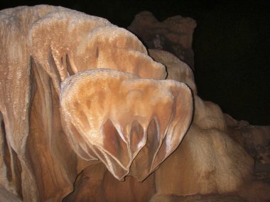 Stalagmites and stalactite in ATM cave in Belize clipart
