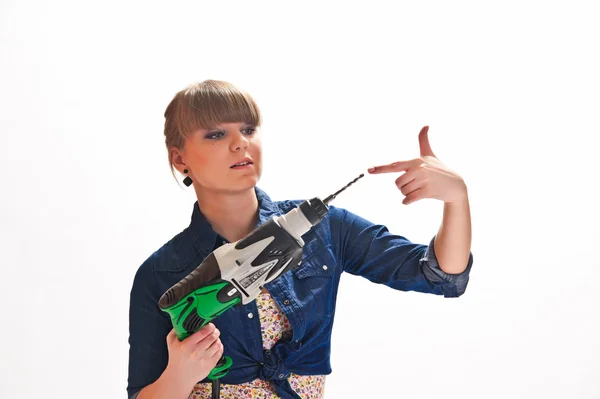 Girl with a drill — Stock Photo, Image