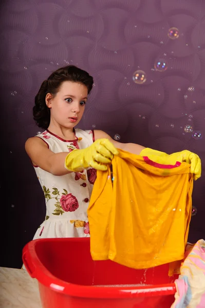 stock image Girl wash clothes in a bucket