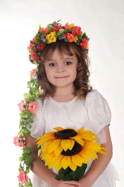 Girl and sunflower — Stock Photo, Image