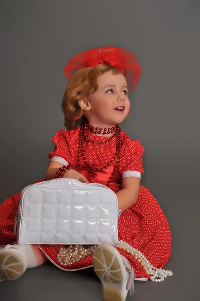 A little girl dressed in a red dress — Φωτογραφία Αρχείου