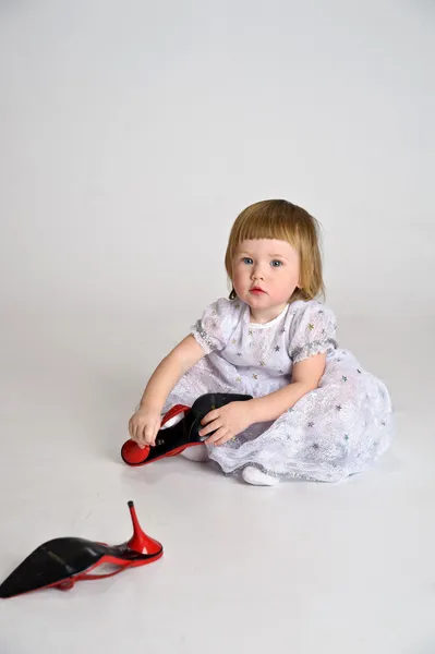 Girl dressed big shoes — Stock Photo, Image