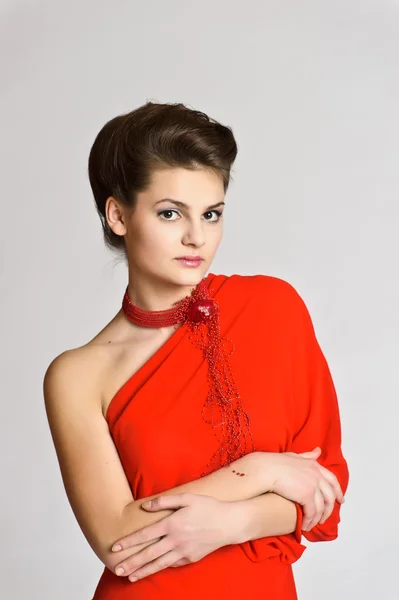 Elegante vrouw in het rood — Stockfoto