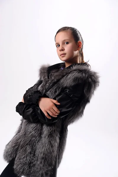 Girl in a fur coat — Stock Photo, Image