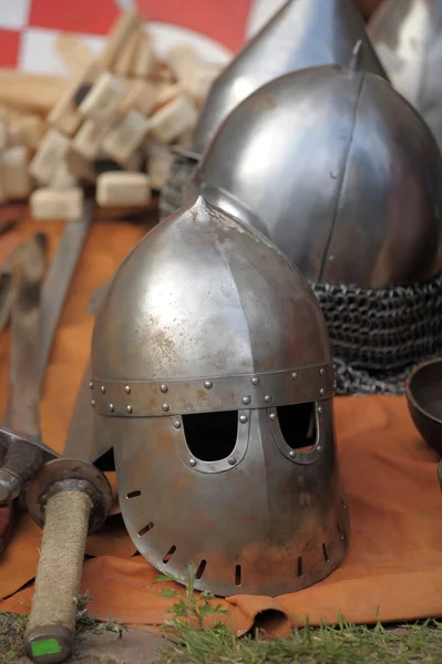 medieval helmets behind