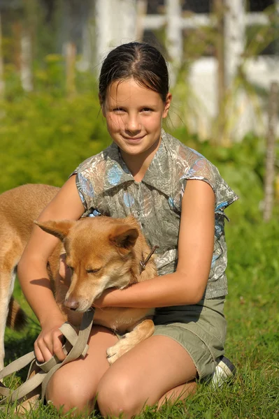 Girl and puppy — Stock Photo, Image