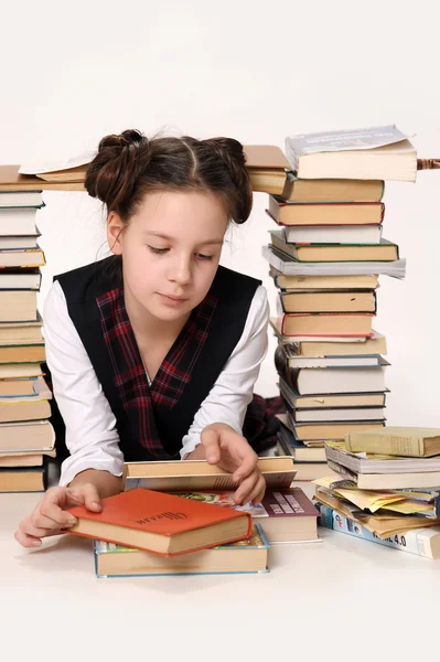 Chica de la escuela joven con muchos libros —  Fotos de Stock